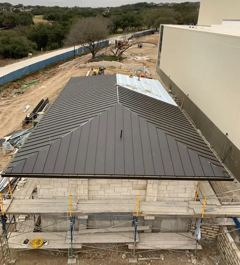 Metal roof new construction with scaffolding in Hope